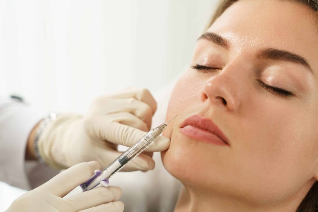 Woman closes her eyes during Restylane® injection